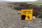 Danger sign in Iceland. Warning of steep cliffs