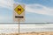 Danger sign for swimmers at the beach in Australia