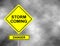 Danger storm coming road sign . Yellow hazard warning sign against grey sky - tornado warning, bad weather warning, vector illustr