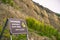 `Danger, unstable cliff edge` sign