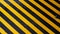 Danger zone sign on floor. Man walking across yellow-black Industrial safety area inside factory. Stripes of warning