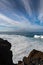 Dangerious ocean stormy waves hits black lava rocks by Faro de las Hoyas, La Palma island, Canary, Spain