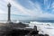 Dangerious ocean stormy waves hits black lava rocks by Faro de las Hoyas, La Palma island, Canary, Spain