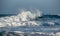 Dangerous big stormy waves during a windstorm at the sea