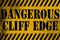 Dangerous cliff edge sign yellow with stripes