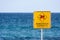 Dangerous currents sign on beach