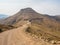 Dangerous and curvy mountain dirt road with steep drop to the valley, Lesotho, Southern Africa