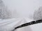 Dangerous driving during blizzard on rural highway