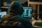 Dangerous hooded hacker breaks into company servers dark atmosphere multiple displays, hacking concept