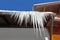 Dangerous large icicles on a house