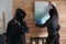 Dangerous masked criminals stealing picture from house