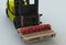 DANGEROUS, message on wooden pillet with forklift truck