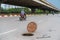 Dangerous opened manhole hole cover, opened sewerage hatch with traffic on background