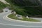 Dangerous panoramic serpentine road high in the Alps