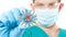 Dangerous respiratory 2019-ncov virus. Doctor in protective mask holding Coronavirus nCov. Outbreaking COVID-19 virus