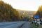 Dangerous road descent in autumn forest