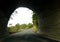 Dangerous road through tunnel carved out of mountain of rock