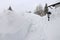 A dangerous roof avalanche has fallen from the roof of a house onto the sidewalk