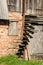 Dangerous spiral wooden stairs without railings at the barn