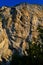 Dangerous and steep high sheer cliff with burrows of birds