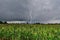 Dangerous thunder and rain storm over corn field