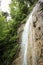 Dangerous trail through a waterfall with steel ladders in the Slovak Paradise National Park, Slovaki