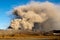 Dangerous view of Mount Aso largest active volcano in Japan during explosion, venting ashes.