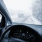Dangerous winter season with snow on the road. The interior of the car from the driver`s point of view - dangerous  traffic in ba