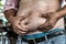 The Dangers of Belly Fat., Obese Man in Jeans Squeeze the Belly