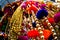 Dangling golden decorations with bells and puffs hanging in a store in chandni chowk delhi
