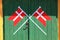 Danish flag painted on wood green door