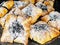 Danish pastry with blueberry jam filling with white powdered sugar