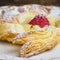 Danish puff pastry pinwheels with vanilla pastry cream and raspb
