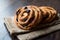 Danish Spiral Cinnamon Raisin Roll / German Pastry Schnecken on Sack.