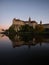 Danube river sunset mirror reflection of medieval fortress castle Schloss Sigmaringen in Baden-Wuerttemberg Germany