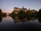 Danube river sunset mirror reflection of medieval fortress castle Schloss Sigmaringen in Baden-Wuerttemberg Germany