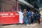 DAR ES SALAAM, TANZANIA - JANUARY 2020: Group of African People Are wathing Football on the street, Big queue Crowd on