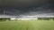 Darck clouds above school football pitch