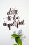 Dare to be imperfect, motivational quote on white paper