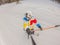 A daring man conquers snowy slopes with style, showcasing skill and thrill as he maneuvers on a snowboard, capturing the