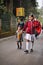 DARJEELING INDIA - APRIL 2012 : Older sister holding hand younger sister on the way to school in Darjeeling, India as of April 12,