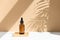 Dark amber glass bottle for oil, cream, lotion or serum on a beige background with a shadow of tropical palm leaves