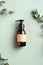 Dark amber glass dispenser bottle with homemade shampoo and eucalyptus leaves on green background