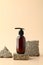 Dark amber glass pump bottle on stone podium. Natural beauty product design, cosmetics branding