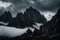 Dark atmospheric surreal landscape with dark rocky mountain top in low clouds in gray cloudy sky.