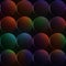 Dark background with balls or circles with rainbow colors