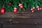 Dark background wooden boards and objects Christmas toys with a place