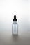 dark backlit face serum in matte bottle