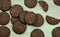 Dark baked chocolate cookies on gray wooden board, table. Top view. Food photography.