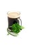 Dark beer in glass and bouquet of false shamrock